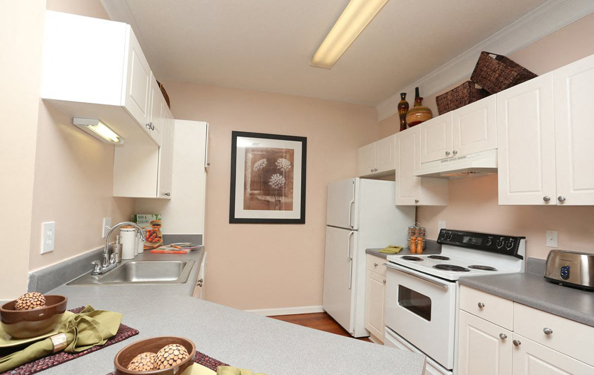 Fully Equipped Kitchen with White Cabinetry and White Appliances, The Columns at Club Drive, Duluth 30096