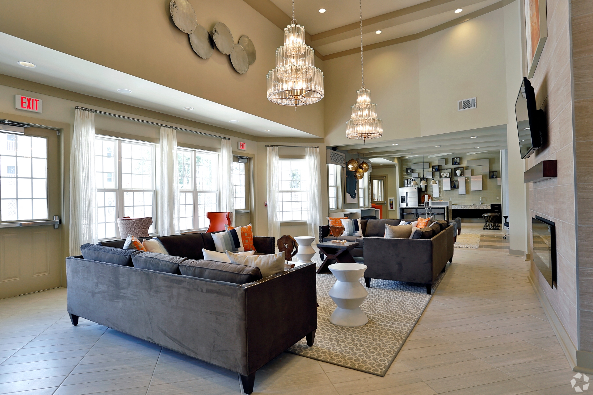 Elegant clubhouse with crystal chandeliers and sofas at The Columns at Coldbrook Station, Port Wentworth