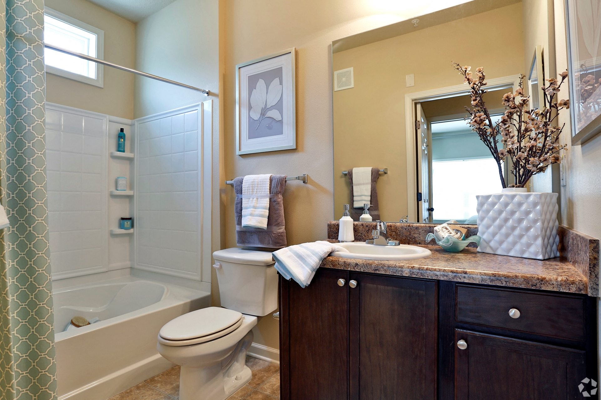 Modern guest bathroom with large tub and window at The Columns at Coldbrook Station, Port Wentworth, 31407