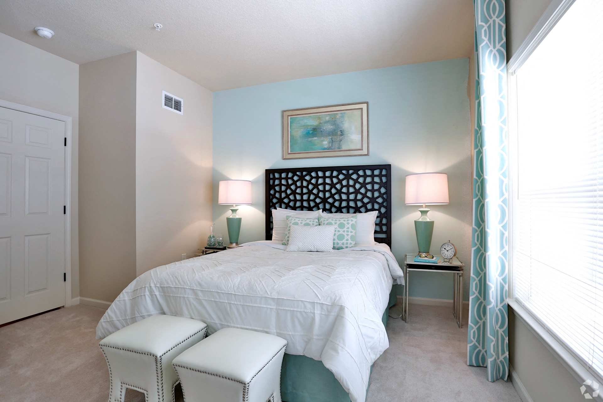 Bright guest bedroom with large window at The Columns at Coldbrook Station, 31407