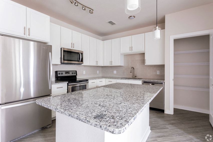 Modern kitchen with large island Modern kitchen with large island,at Estero Parc, Estero, FL, 33928