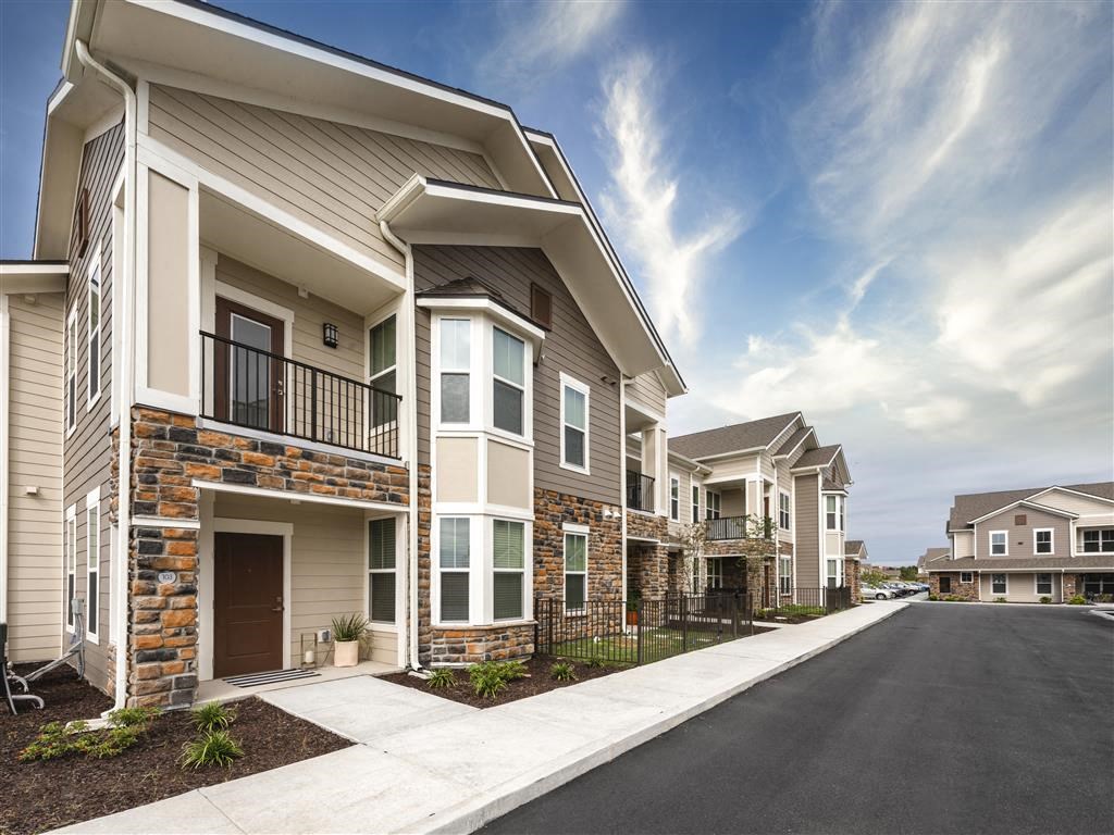 a row of houses with a street in front of them at Verso Apartments, Davenport, FL