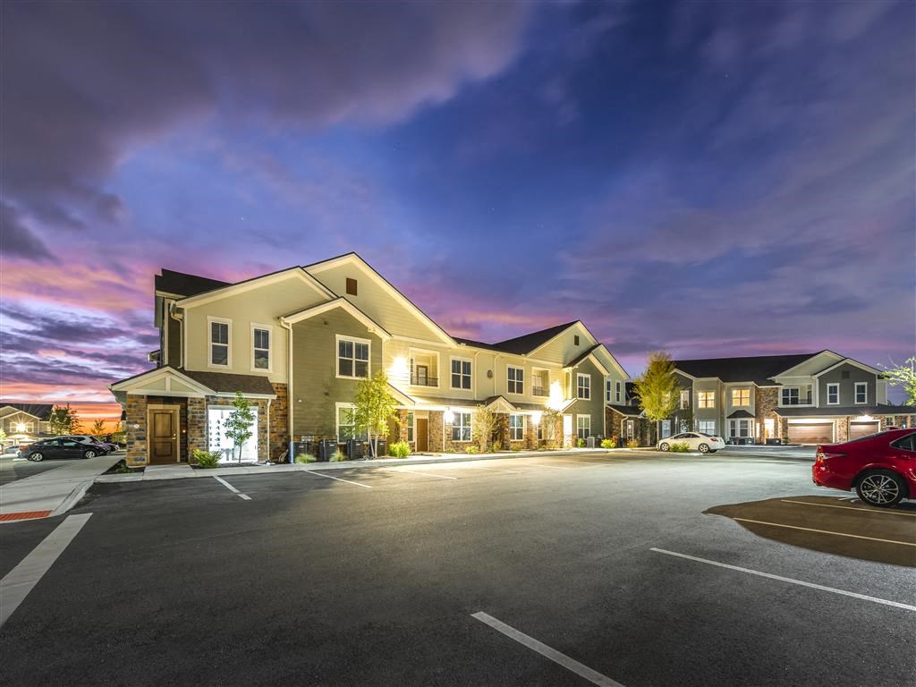 a building with a parking lot in front of it at Verso Apartments, Davenport, Florida