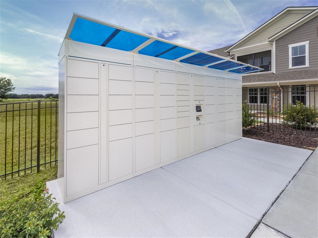 a white garage door with a blue awning on top at Verso Apartments, Florida