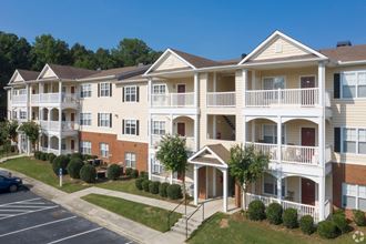 Building exteriors with mature landscaping Building exteriors with mature landscaping at The Columns at Hiram, Hiram, Georgia - Photo Gallery