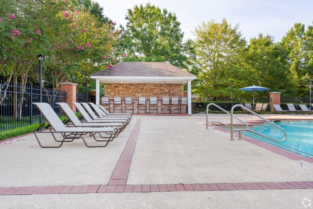 Pool deck with outdoor entertaining area and bar seating at The Columns at Hiram, Hiram, GA 30141