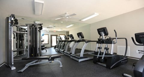 Modern fitness center with cardio machines and strength training at The Columns at Hiram, Hiram, Georgia