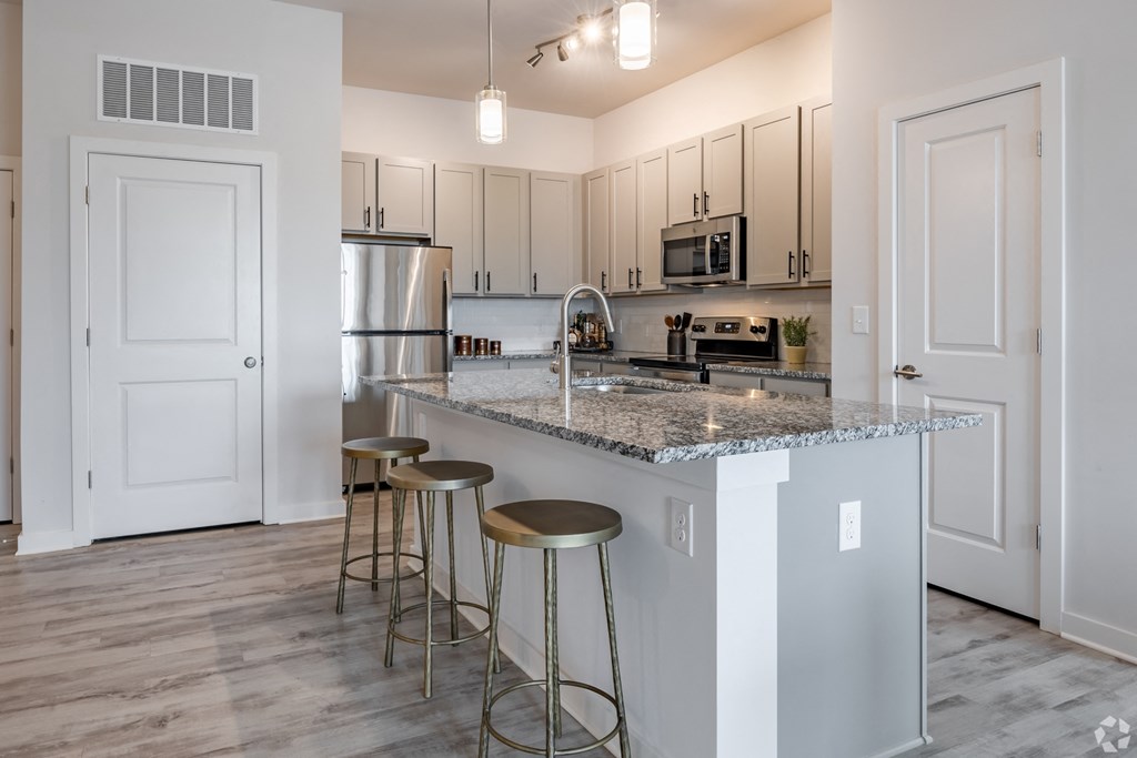 Fitted Kitchen With Island Dining at The Corwyn South Point, McDonough, Georgia