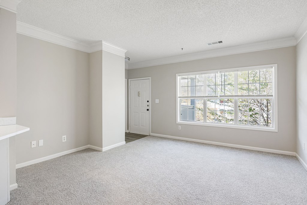 a bedroom with a large window