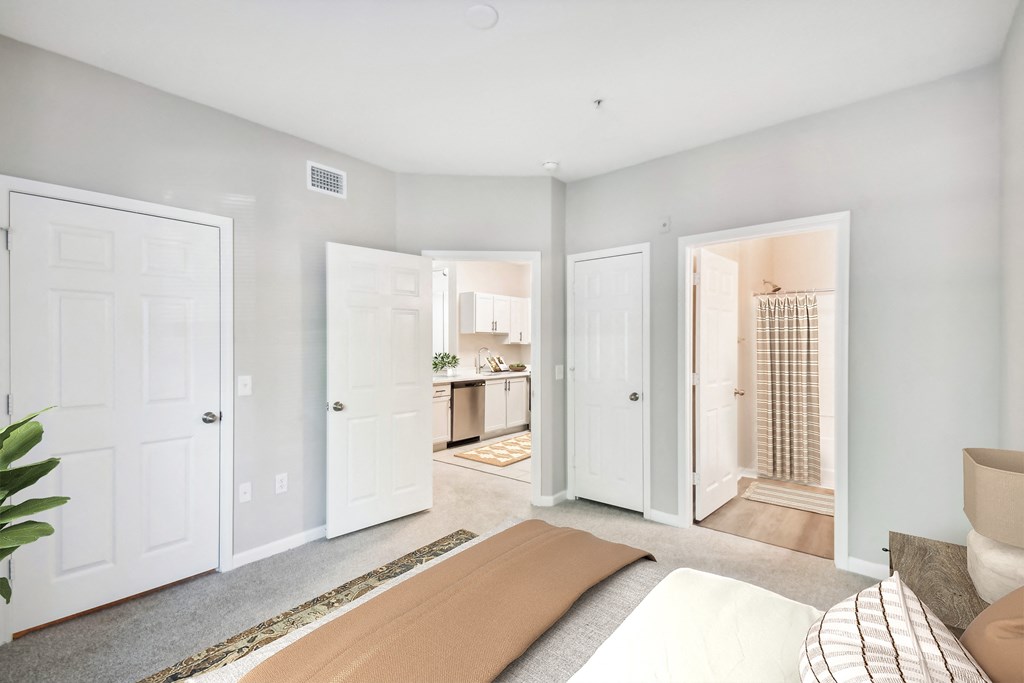 a bedroom with a bed and two doors