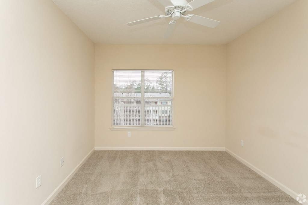 Additional view of guest bedroom with large window at The Columns at Oakwood, 2102 Education Way, GA