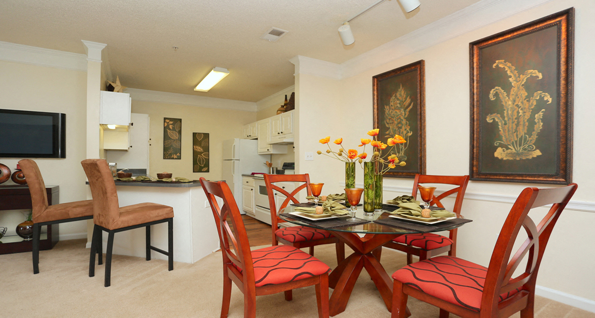 Cozy dining room with kitchen views at The Columns at Paxton Lane, Lilburn, 30047
