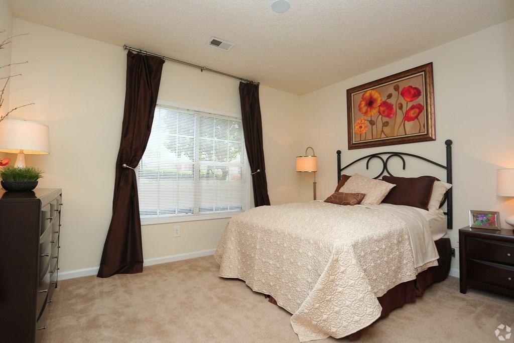 Guest bedroom with airy window and modern décor at The Columns at Paxton Lane, 4305 Paxton Lane SW, Lilburn, GA 30047