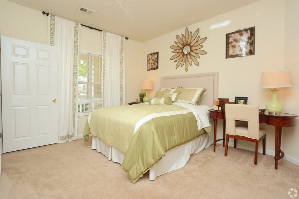 Natural sunlight shining through large window in main bedroom at The Columns at Paxton Lane, Georgia