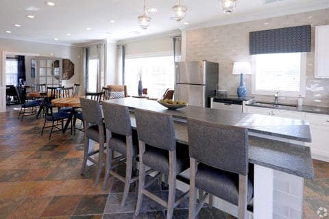 Beautiful clubhouse kitchenette with bar seating at The Columns at Pilgrim Mill, Cumming, 30041