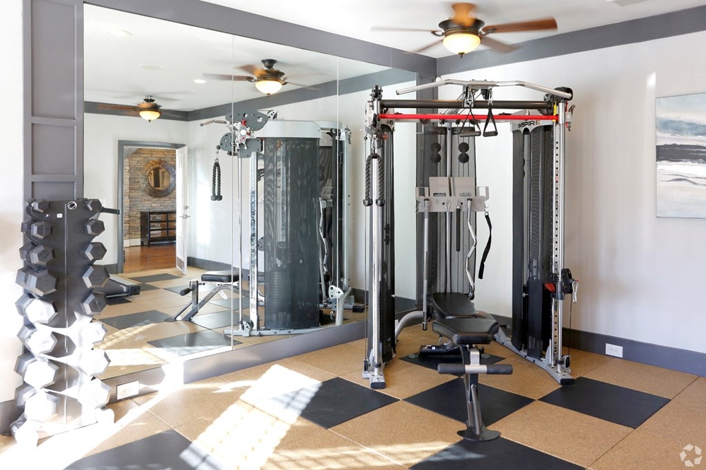 Strength training machines in fitness center at The Columns at Pilgrim Mill, 2090 Columns Drive, 30041