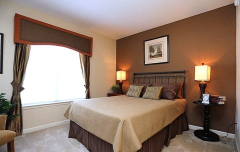 Bright guest bedroom with 9 foot ceilings and large windows at The Columns at Pilgrim Mill, 30041