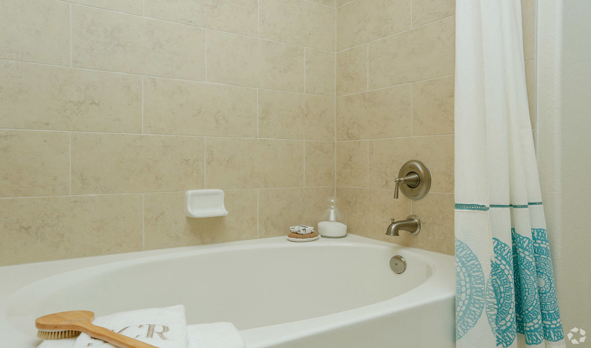 Inviting soaking tub with tile surround, The Columns at Shadow Creek Ranch, Pearland, TX