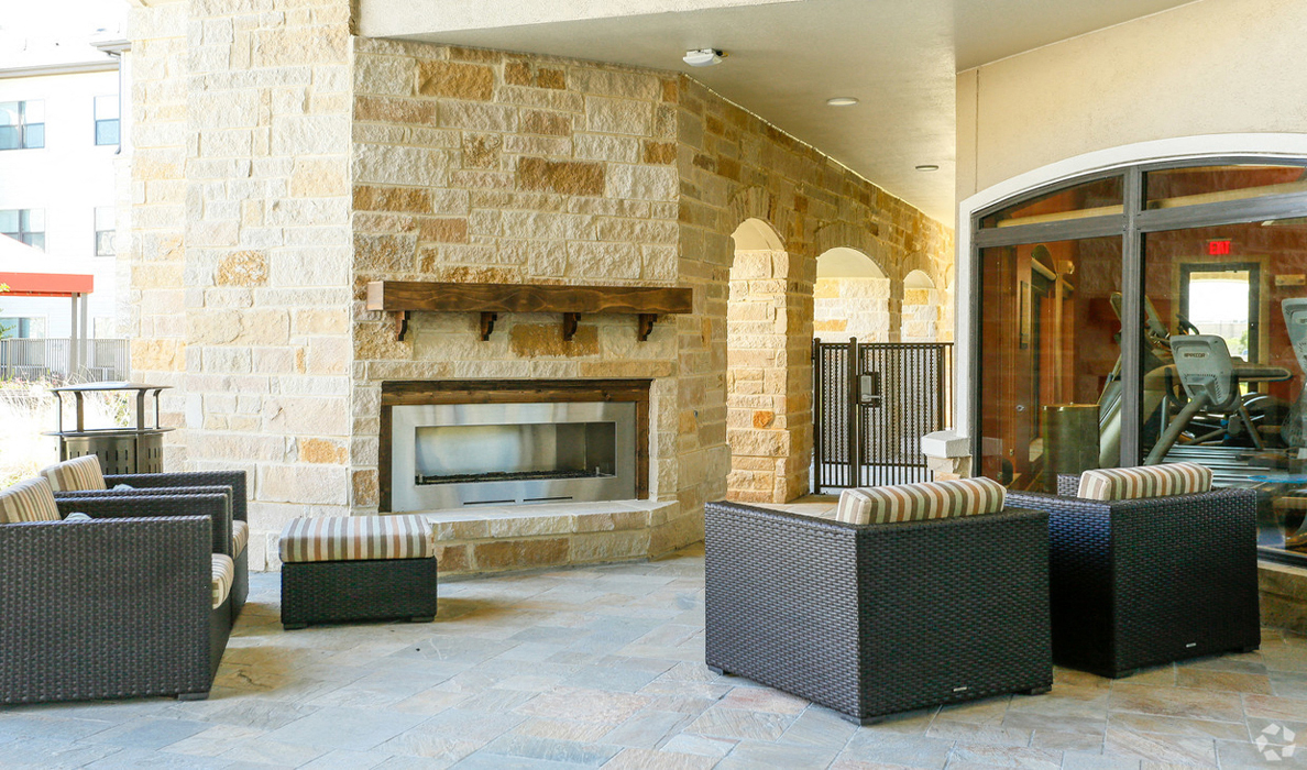 Breezy Lanai with Fireplace and Outdoor Seating at The Columns at Shadow Creek Ranch, Pearland