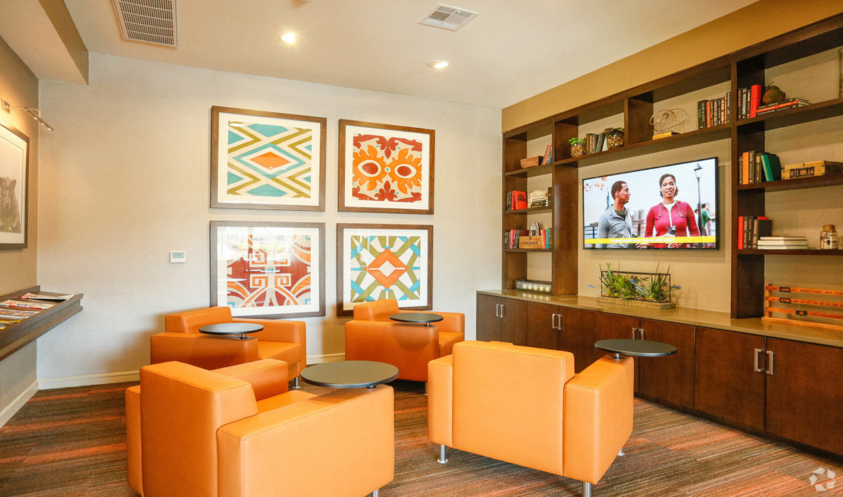 Lounge area with workspace seating and TV, The Columns at Shadow Creek Ranch Pearland, TX