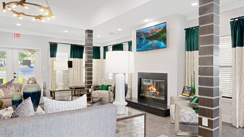 a living room with a fireplace and couches