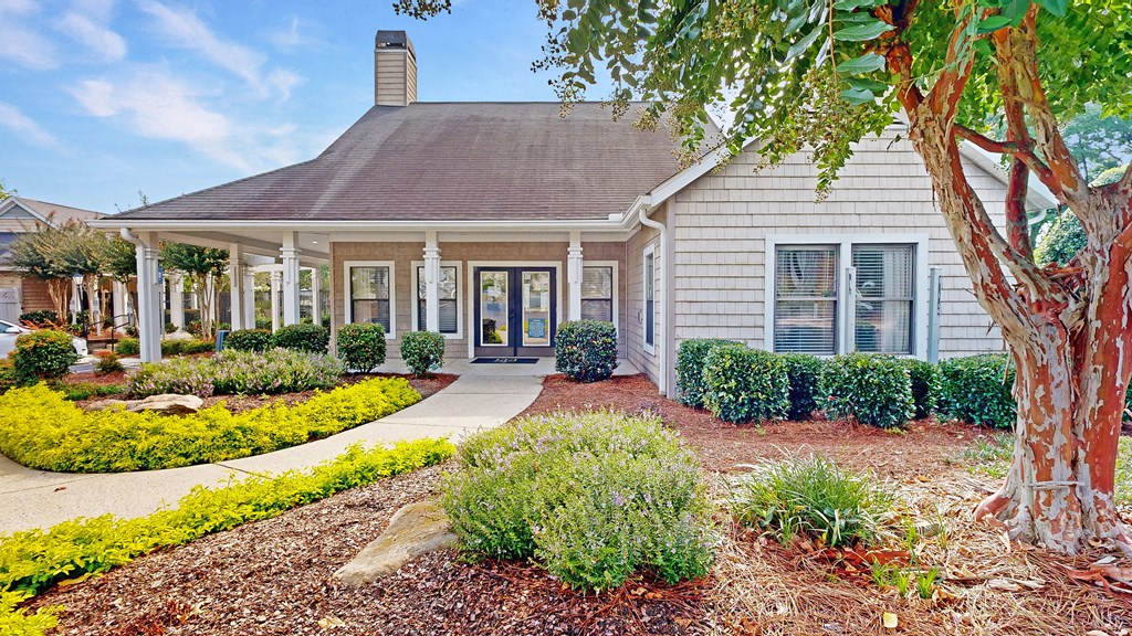 a house with a tree in front of it