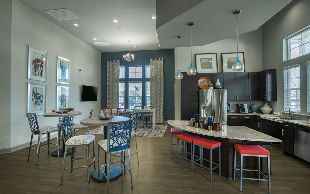 a resident clubhouse with a kitchen and dining area