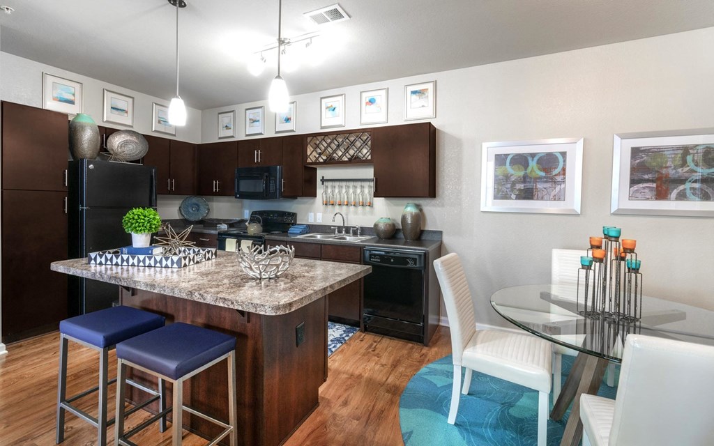 a kitchen and dining area in a 555 waverly unit