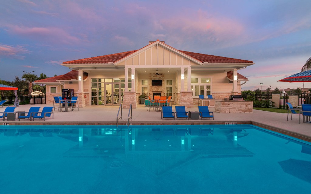 a house with a swimming pool in front of it