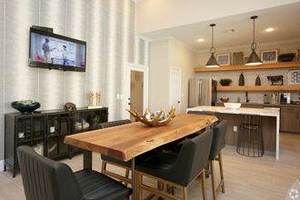 Clubhouse kitchen with table seating for 6  at The Columns at Westchase, 77042 - Photo Gallery 3