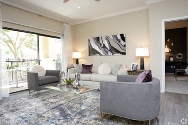 2 Bedroom 2 Bathroom Living Room with natural lighting at The Columns at Westchase - Photo Gallery 4