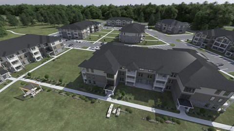 an aerial view of a large apartment complex with a helicopter parked in front of it