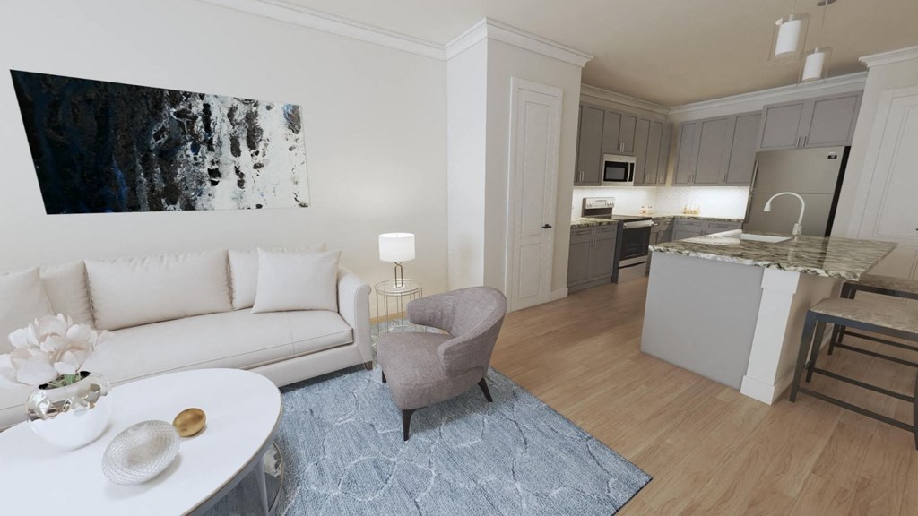 a living room with a couch a table and a chair