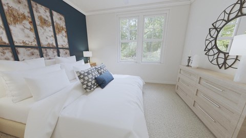 a bedroom with a bed and a dresser in front of a window