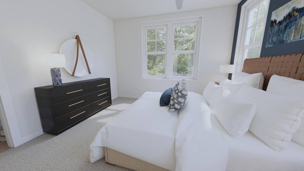 a bedroom with a bed and a dresser