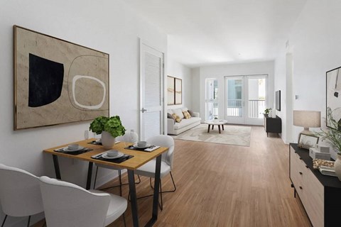 A modern dining room with a wooden table and chairs.