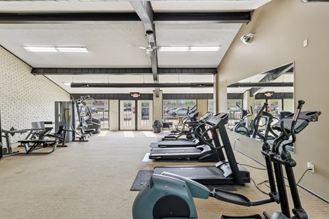 A gym with treadmills and exercise equipment.