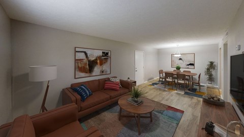 A living room with a brown couch and a coffee table.