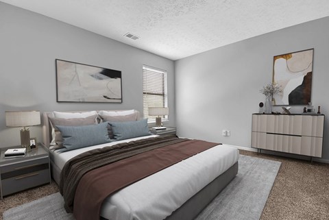 A bedroom with a large bed and a painting on the wall.