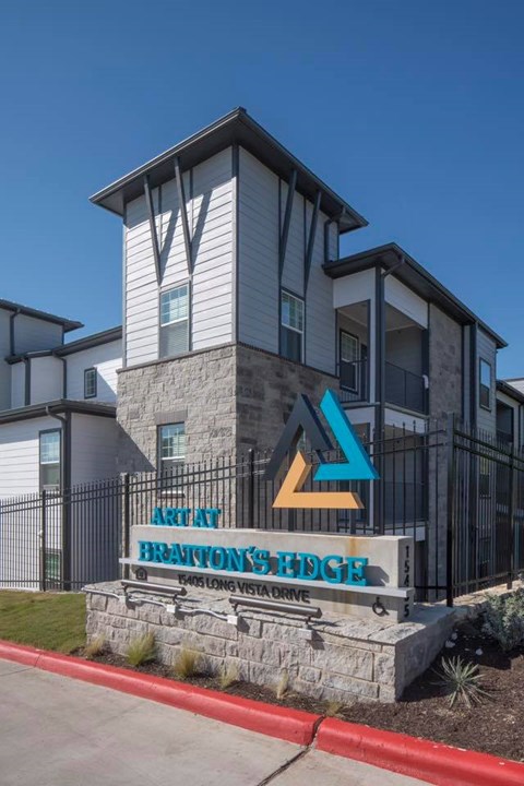 The image shows a building with a sign that reads "Arclay Brantons Hedge".
