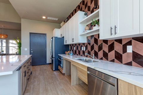 A kitchen with a blue refrigerator and wooden cabinets.