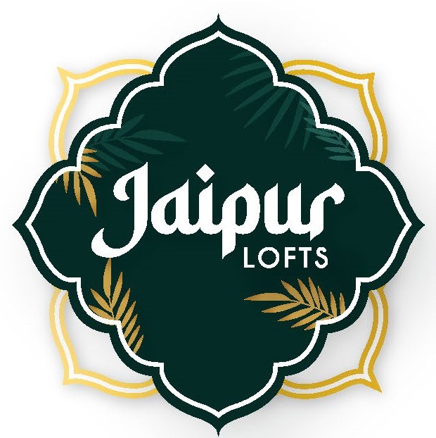 A logo with the text "Jaipur Lofts" surrounded by a decorative border.