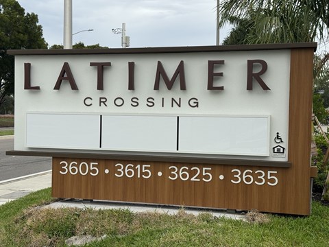 A sign for Latimer Crossing with numbers 3605, 3615, 3625, and 3635 on it.