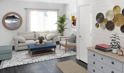 A living room with a white couch, a blue coffee table, and a mirror on the wall.