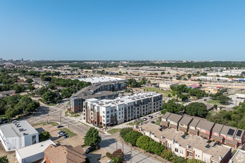 A cityscape with a mix of residential and commercial buildings.