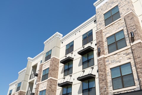 A modern building with a clear blue sky in the background.