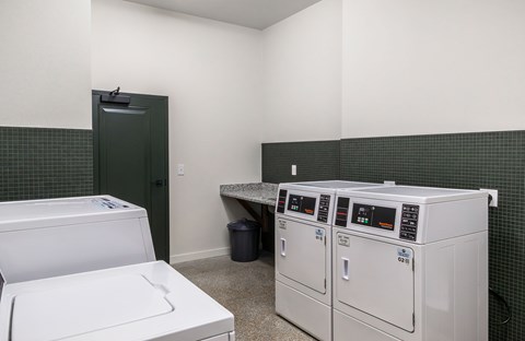 A laundry room with a washer and dryer.