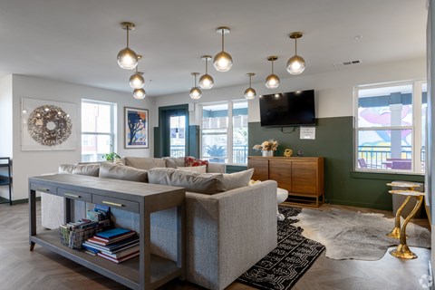 A living room with a grey sofa and a coffee table.