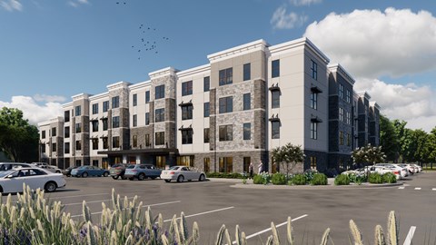 A modern apartment complex with a parking lot in front.