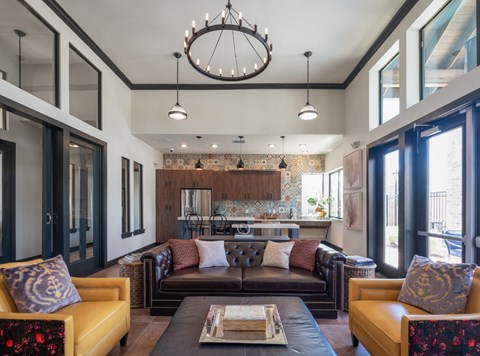 A modern living room with a large sectional sofa and a coffee table.